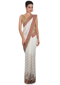 White georgette saree adorned with sequins and zari work only on Kalki