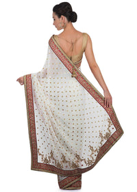 White georgette saree adorned with sequins and zari work only on Kalki