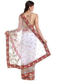 White net saree adorned with sequins and zardosi craft only on Kalki