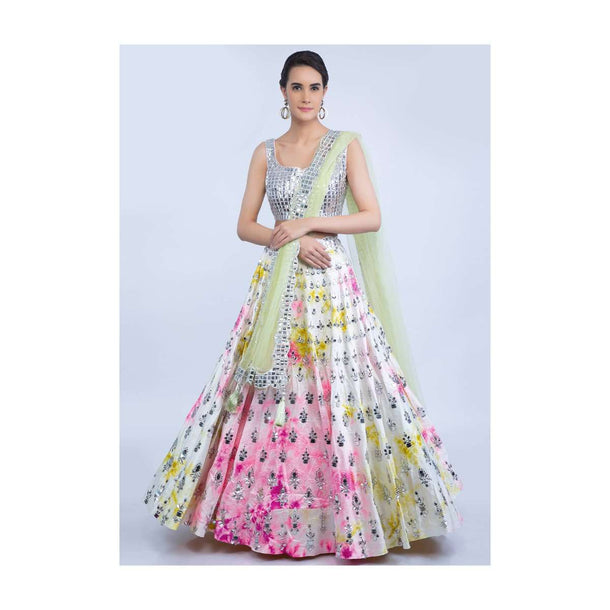 White raw silk tye and tye lehenga with silver beaded blouse and green net dupatta only on Kalki