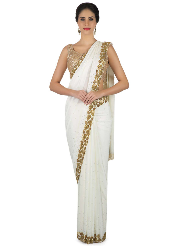 White saree in georgette with leaf motif embroidery in cut dana work only on Kalki