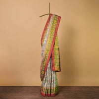 White Cotton Silk Saree With Ikat Patola Work And Unstitched Blouse Fabric