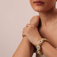 White Finish Temple Bangle With Floral Motifs And Meenakari Work