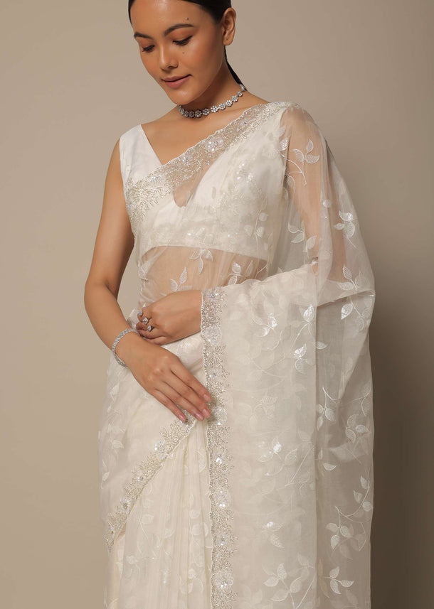 White Organza Saree With Floral Sequin Work And Unstitched Blouse Piece