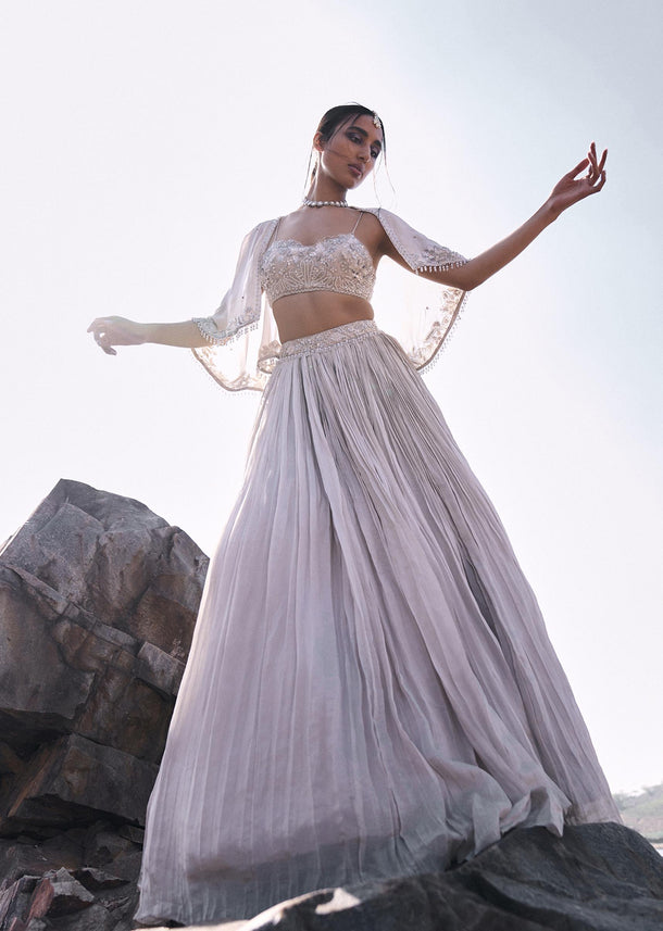 White Ruched Lehenga With Spaghetti Blouse And Cape