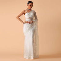 White Saree In Organza With Floral Motif Border And Unstitched Blouse Piece