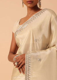 White Saree In Tissue Silk With Gota Patti Work And Unstitched Blouse Piece