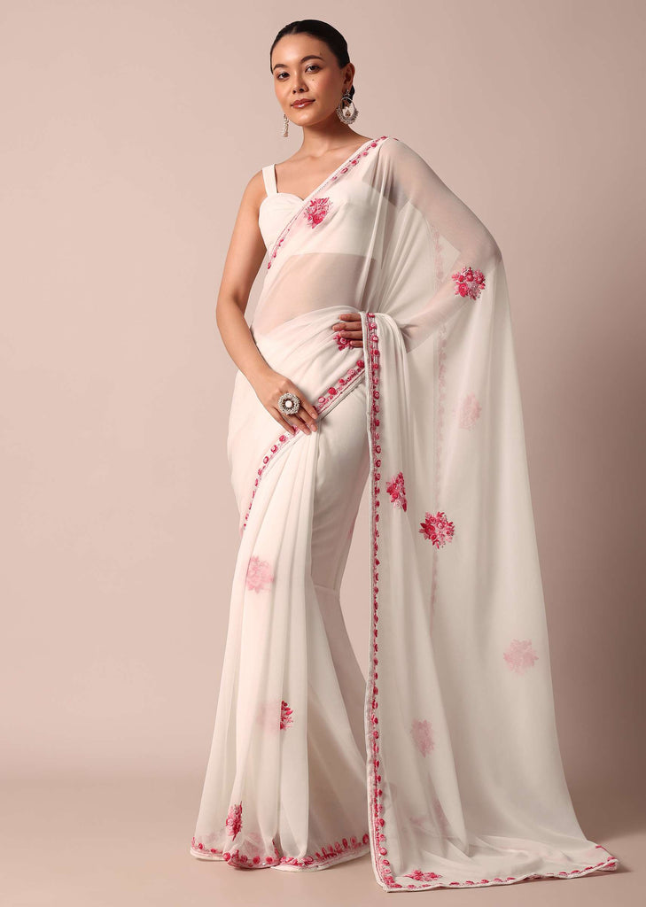 White saree with floral embroidery and unstitched blouse