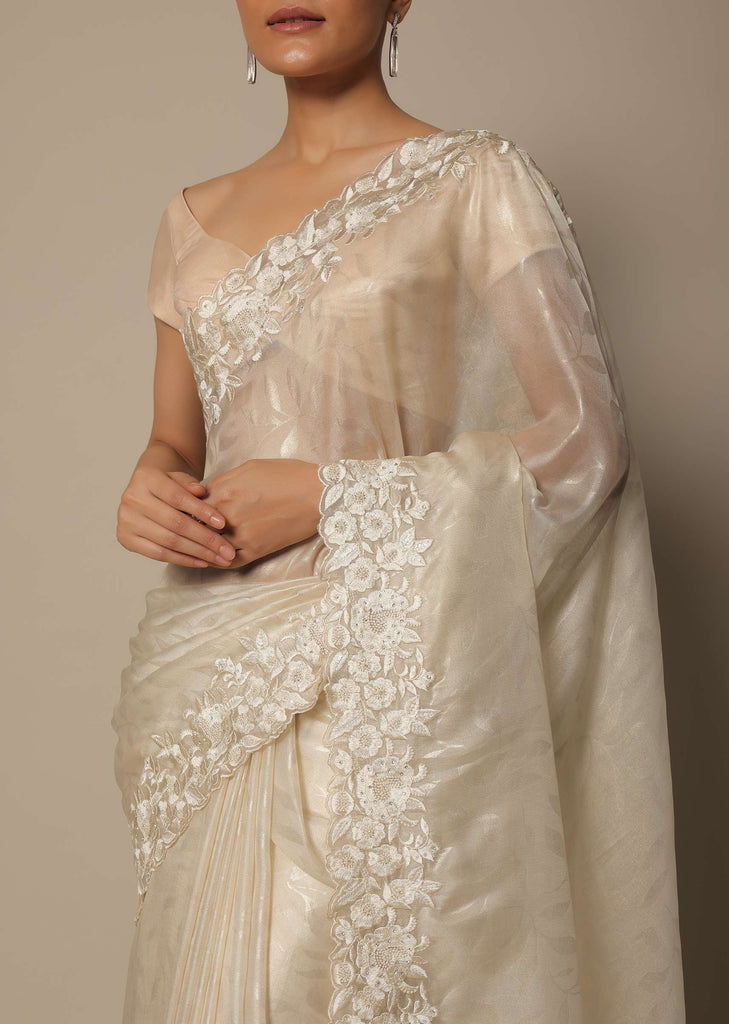 White Satin Saree With Floral Motif Thread Work And Unstitched Blouse Piece