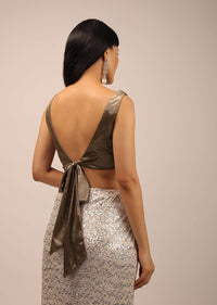 White Sequins Saree With A Contrasting Henna Green Sleeveless Blouse