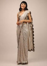 White Sequins Saree With A Contrasting Henna Green Sleeveless Blouse