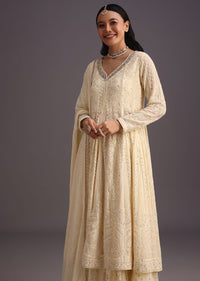 White Thread Work Kurti With Banarasi Weave Skirt And Butti Work Dupatta