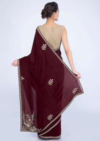 Wine crepe silk saree with embroidered butti and border only on Kalki