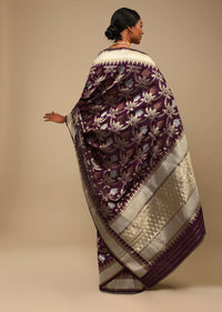 Wine Purple Saree In Art Handloom Silk With Three Toned Woven Floral Jaal, Geometric Motifs On The Pallu And Unstitched Blouse