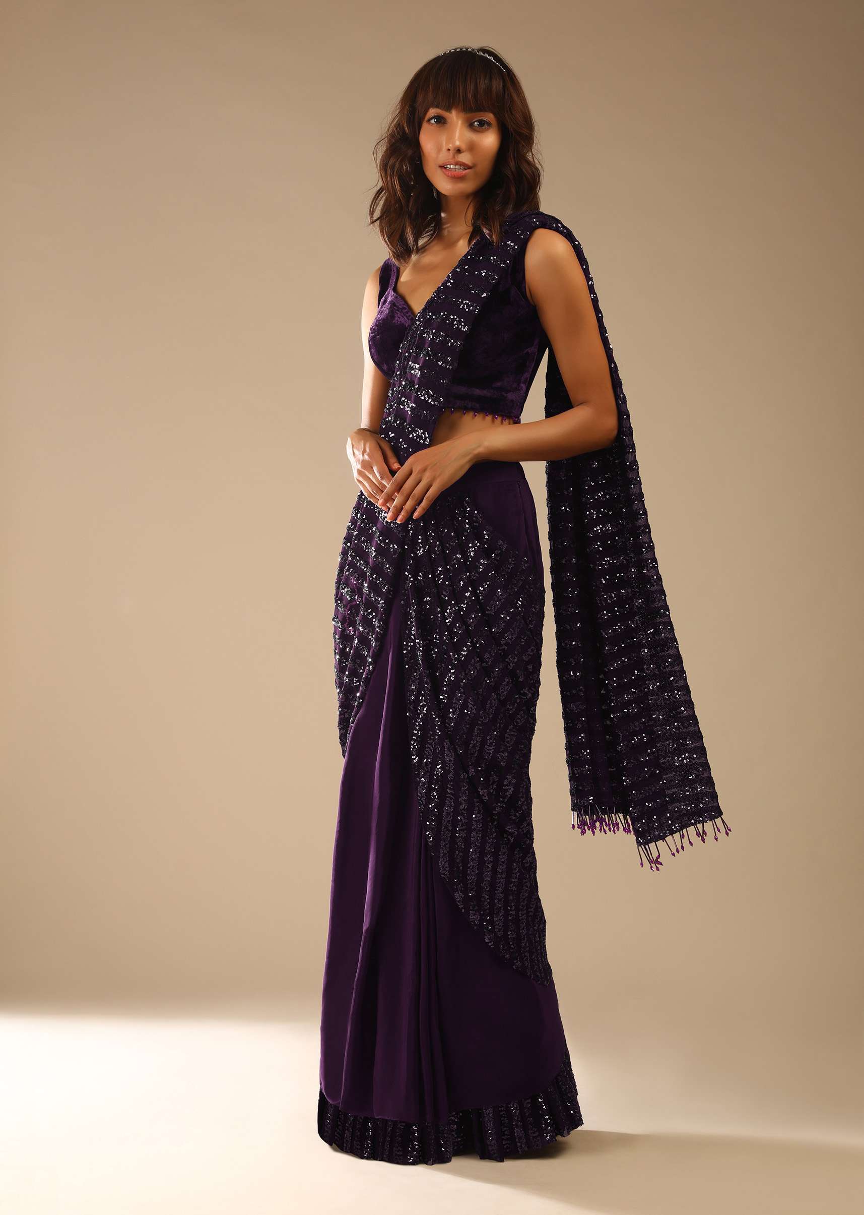 Wine Purple Ready Pleated Saree In Crepe With Striped Sequins Pallu And Matching Velvet Blouse With Bead Tassels