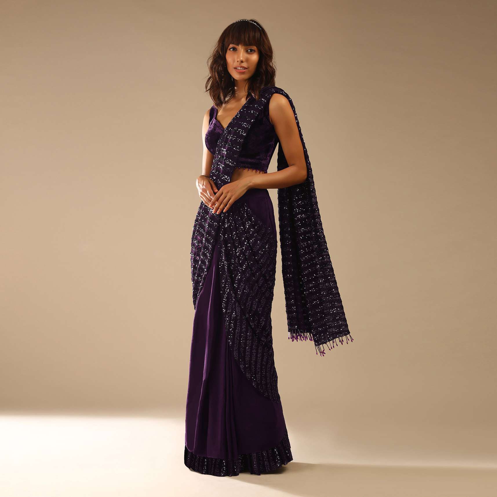 Wine Purple Ready Pleated Saree In Crepe With Striped Sequins Pallu And Matching Velvet Blouse With Bead Tassels