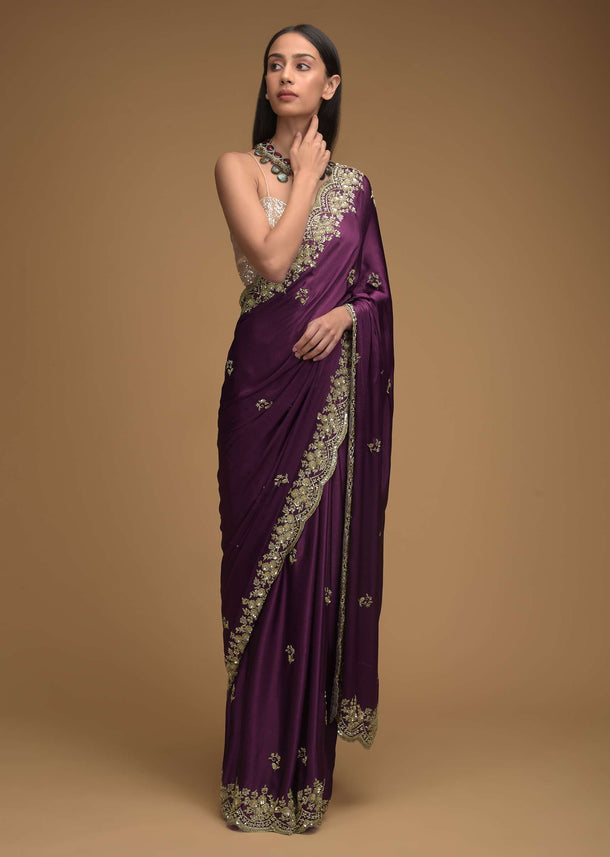 Wine Purple Saree In Satin With Hand Embroidered Scalloped Border And Floral Buttis Along With Unstitched Blouse