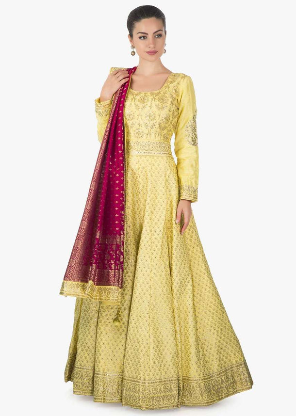 Yellow anarkali suit adorn in digital print further embellished in sequin only on Kalki