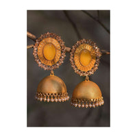 Yellow Embossed Jhumkas With Stone Studded Oval Motif, Crystals And Dangling Pearl Online - Kalki Fashion