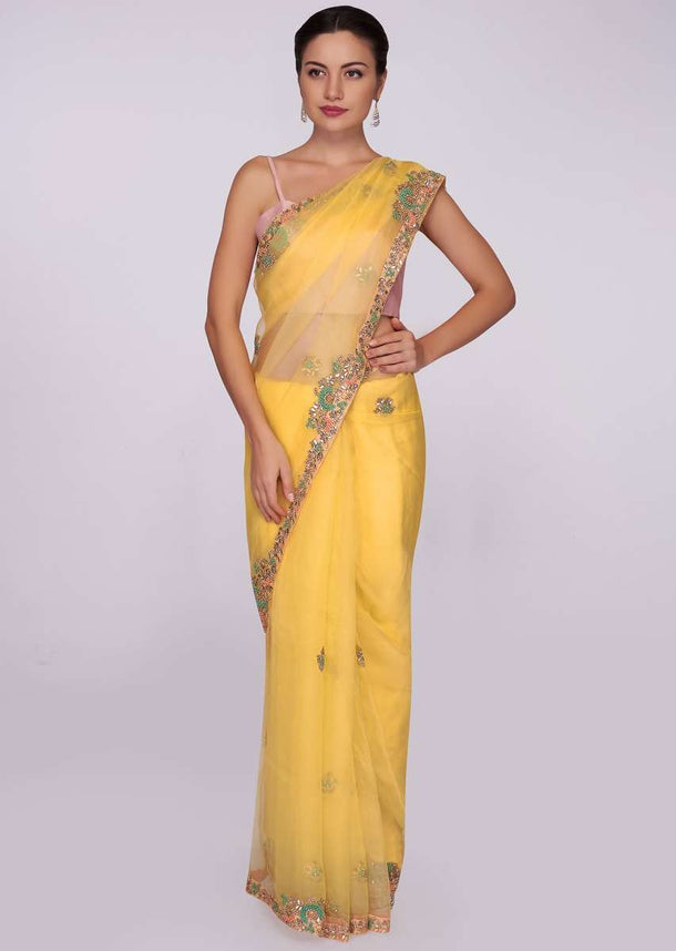 Yellow organza saree with embroidered butti and border