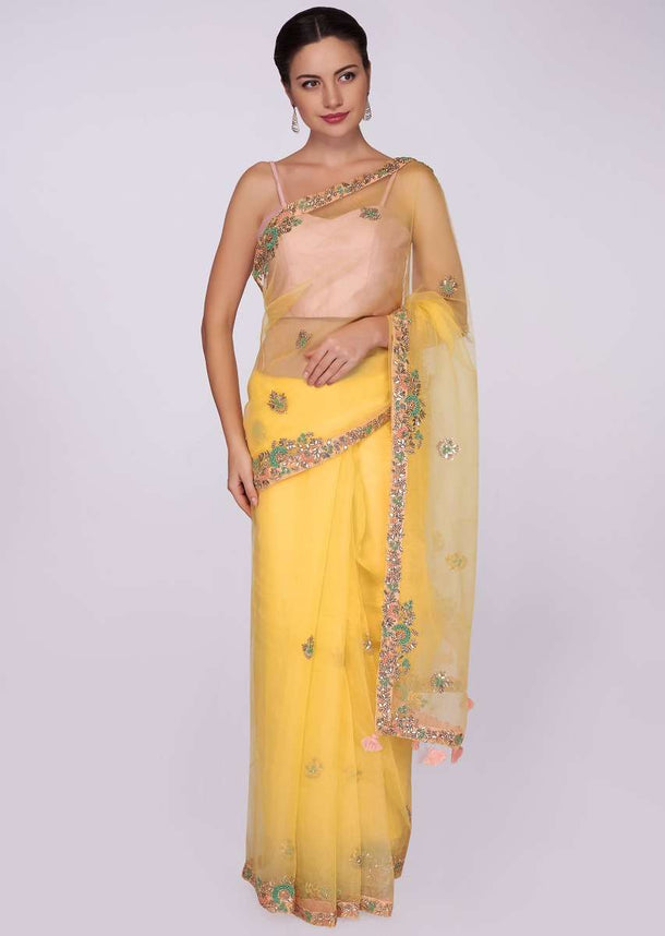 Yellow organza saree with embroidered butti and border