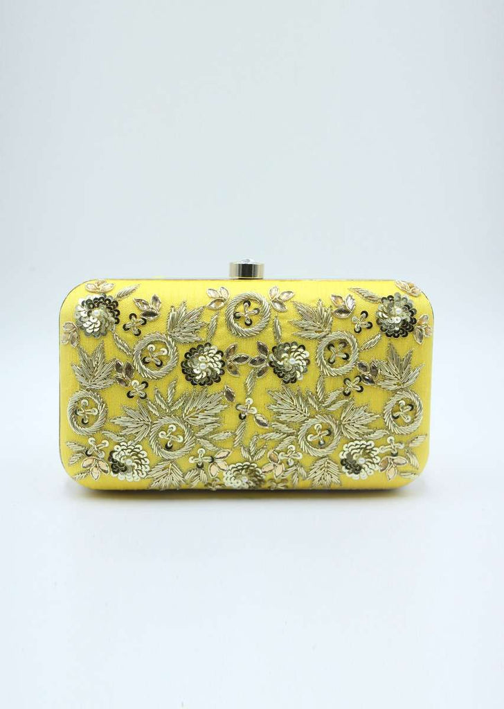 Yellow sling clutch bag embellished in zardosi floral embroidery