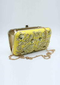 Yellow sling clutch bag embellished in zardosi floral embroidery
