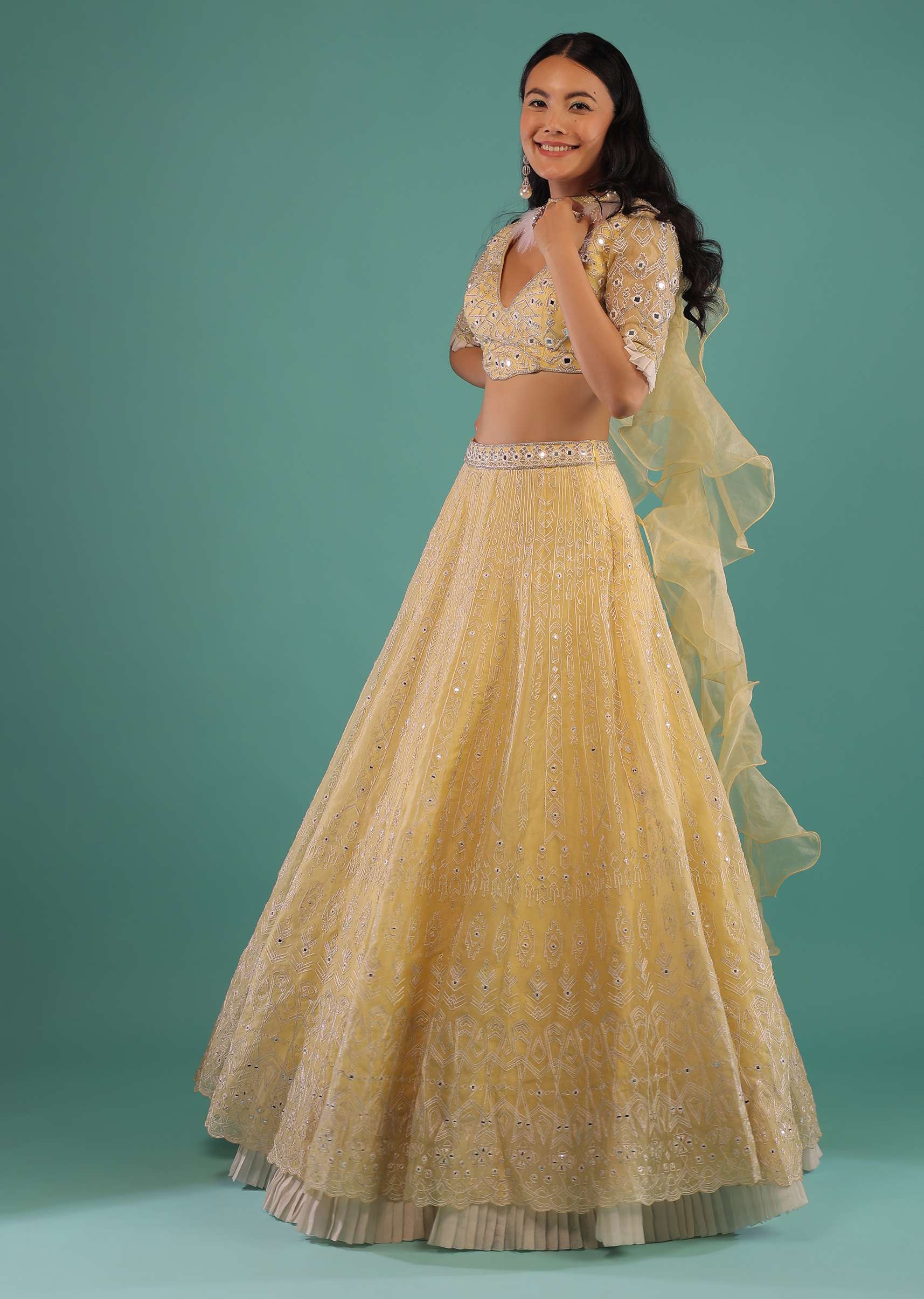 Yellow Lehenga Choli In Organza With Aari Embroidered Tribal Motifs And Feather Detailed Ruffle Dupatta