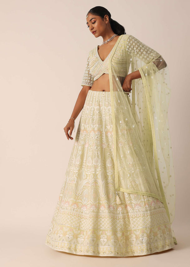 Yellow Net Embroidered Blouse And Skirt Set