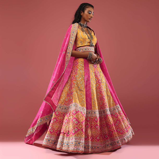 Chrome Yellow Patola Printed Silk Lehenga With Bandhani Kalis And Gotta Hand Embroidery