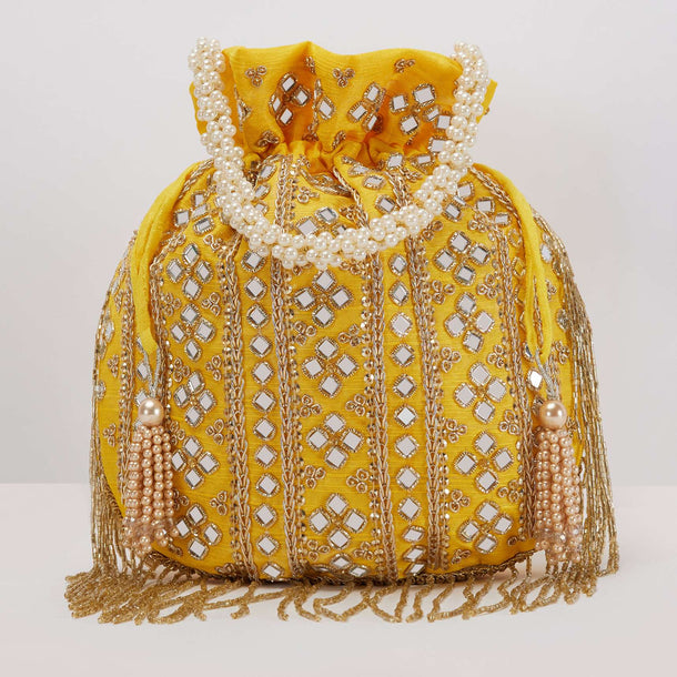 Yellow Potli In Satin With Hand Embroidery Detailing Using Mirror And Cut Dana Fringes