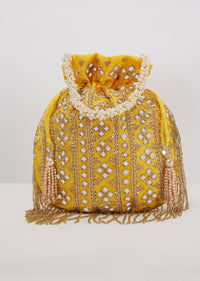 Yellow Potli In Satin With Hand Embroidery Detailing Using Mirror And Cut Dana Fringes