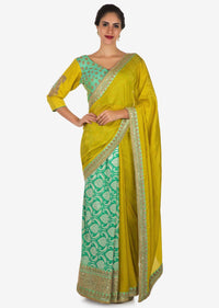 Yellow saree in cotton with ready stitched blouse embellished in zari butti embroidery only on Kalki