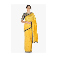 Yellow saree in silk with ready stitched blouse beautified in resham and cut dana work only on Kalki