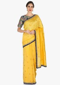 Yellow saree in silk with ready stitched blouse beautified in resham and cut dana work only on Kalki