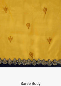 Yellow saree in silk with ready stitched blouse beautified in resham and cut dana work only on Kalki